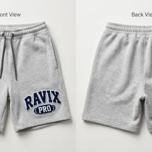Custom Grey Sweat Shorts with Collegiate Patch Logo – front and back view, custom manufactured by Ravix Pro Industry, Sialkot