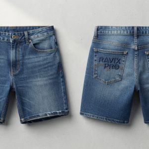 Custom Mid Wash Denim Shorts with Tonal Back Logo – front and back view, custom manufactured by Ravix Pro Industry, Sialkot