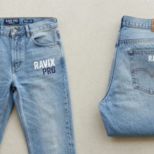 Custom Light Wash Jeans with Printed Thigh Logo – front and back view, custom manufactured by Ravix Pro Industry, Sialkot