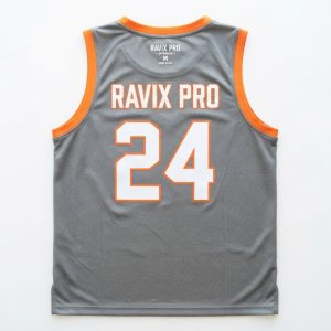 Custom Heather Grey and Orange Basketball Jersey with Arched Team Name – custom manufactured by Ravix Pro Industry, Sialkot, Pakistan