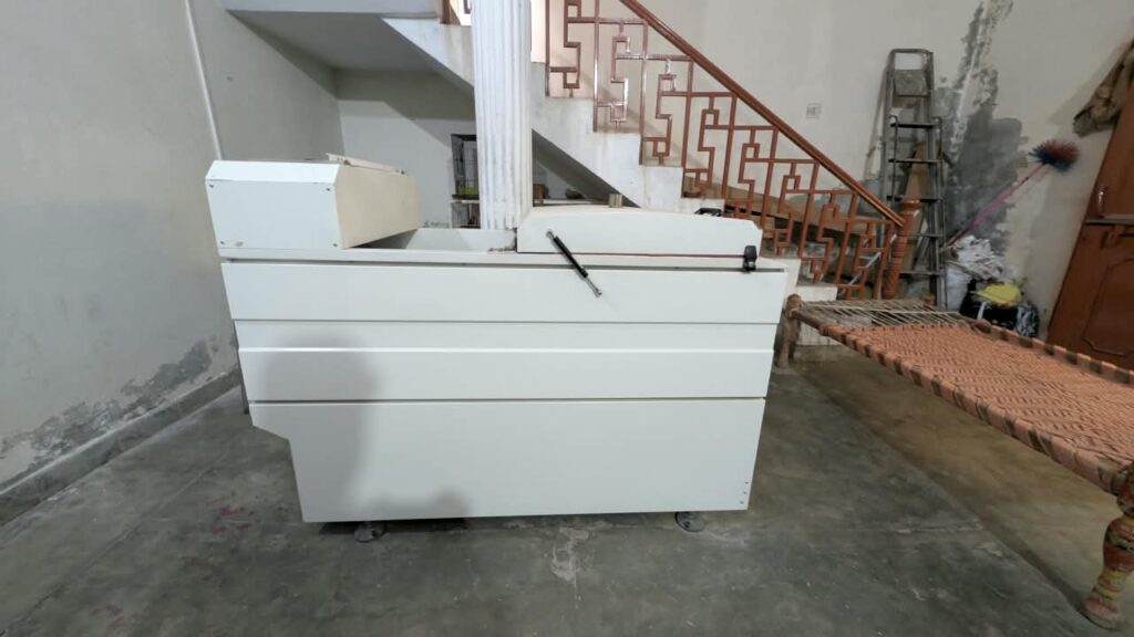 DTF powder shaker and heat conveyor dryer at Ravix Pro Industry clothing factory in Daska, Sialkot, Pakistan