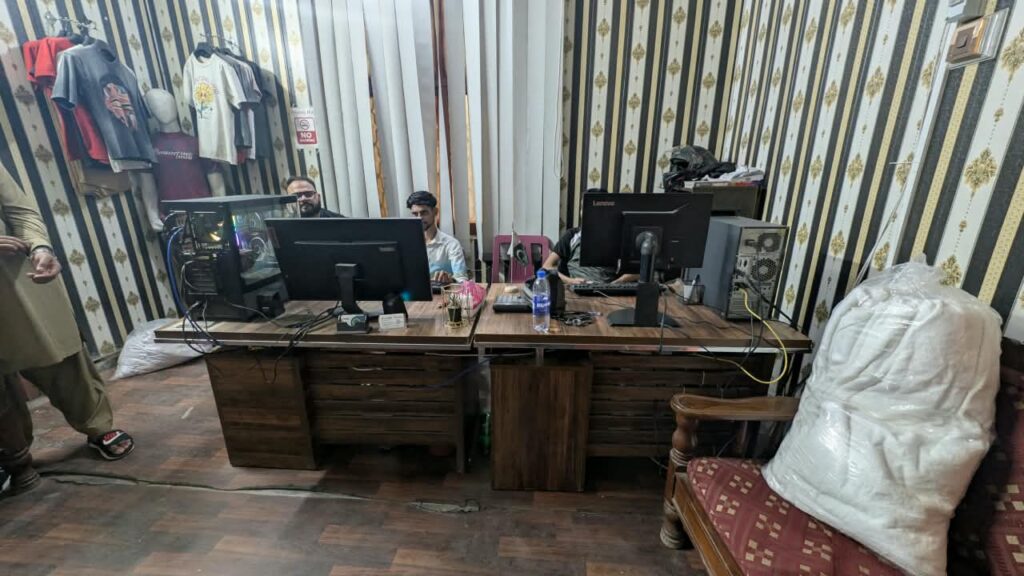 Design team working on tech packs and artwork at Ravix Pro Industry clothing factory in Daska, Sialkot, Pakistan