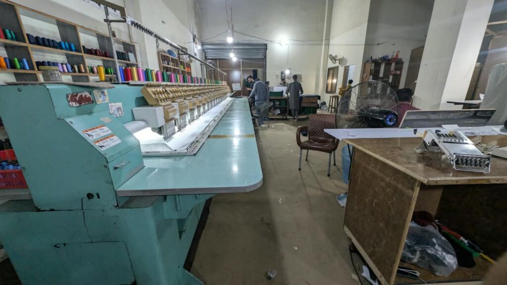 Embroidery machines in the embroidery department at Ravix Pro Industry clothing factory in Daska, Sialkot, Pakistan