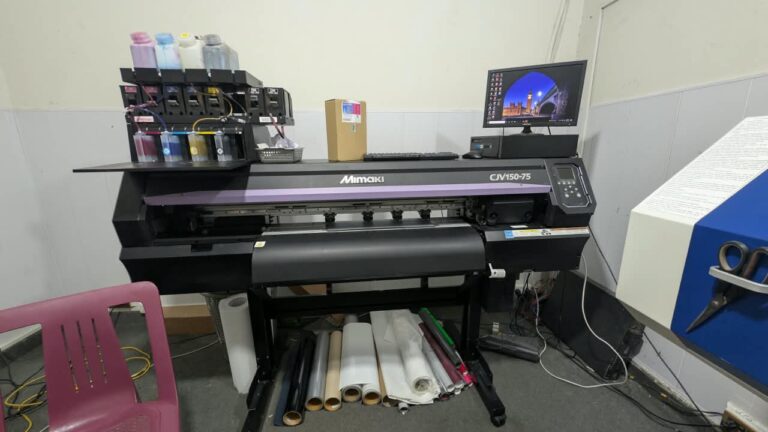 Cutting machine for precise fabric and transfer cutting at Ravix Pro Industry clothing factory in Daska, Sialkot, Pakistan