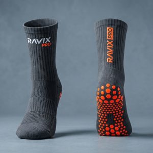 Custom Charcoal and Orange Grip Socks – custom manufactured by Ravix Pro Industry, Sialkot, Pakistan