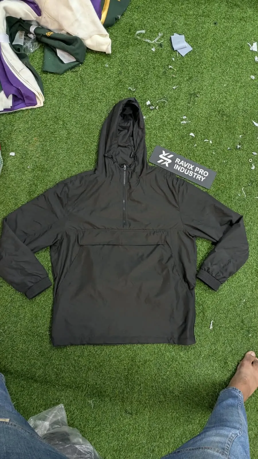 Custom black pullover anorak hoodie made by Ravix Pro Industry clothing manufacturer in Sialkot, Pakistan