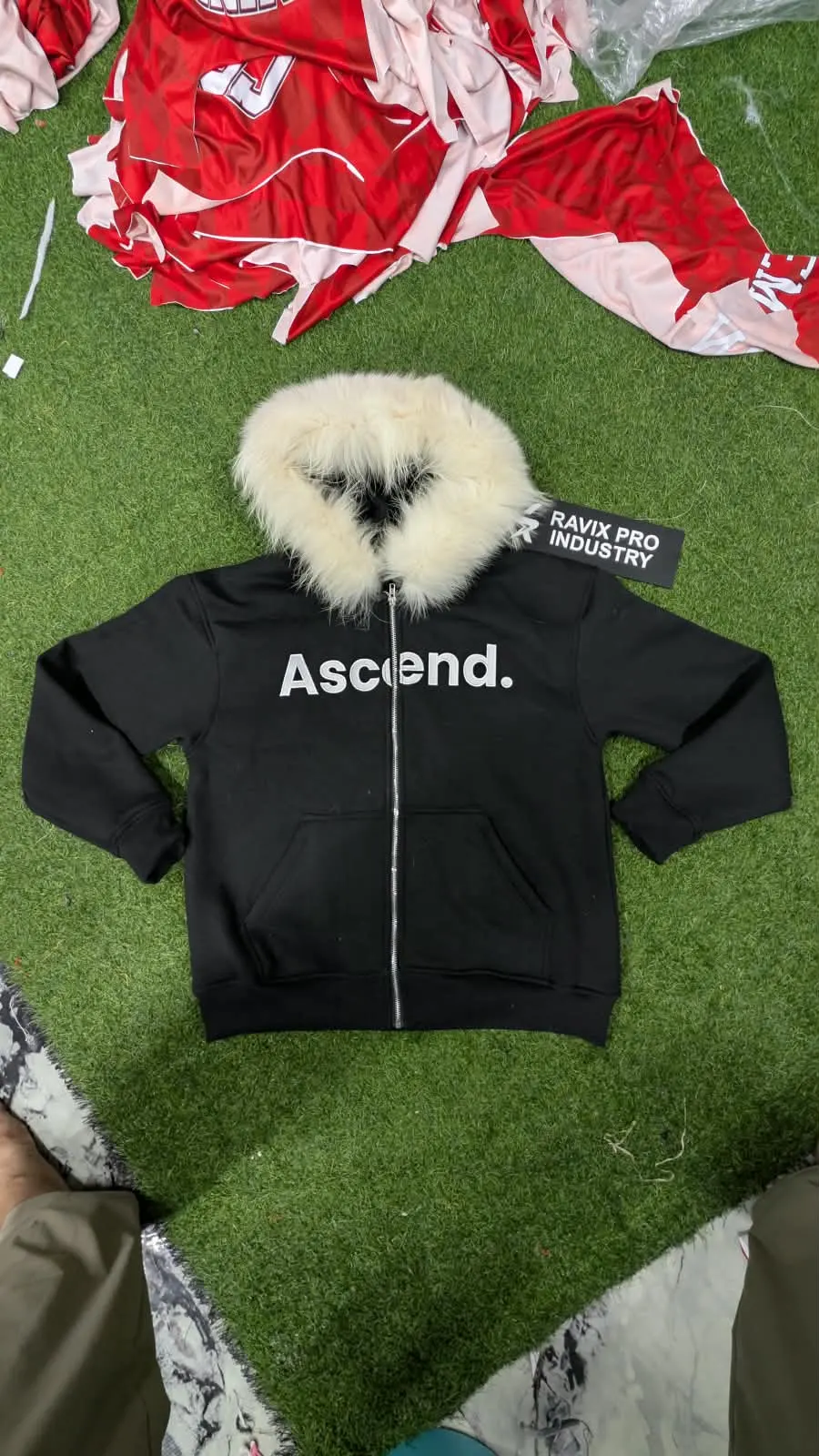Custom black zip hoodie with faux fur hood trim made by Ravix Pro Industry clothing manufacturer in Sialkot, Pakistan