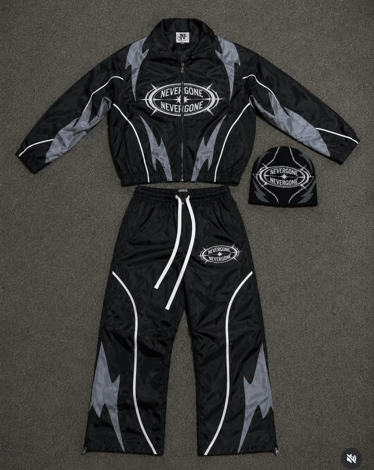 Custom black motocross-style jacket and pants set made by Ravix Pro Industry clothing manufacturer in Sialkot, Pakistan