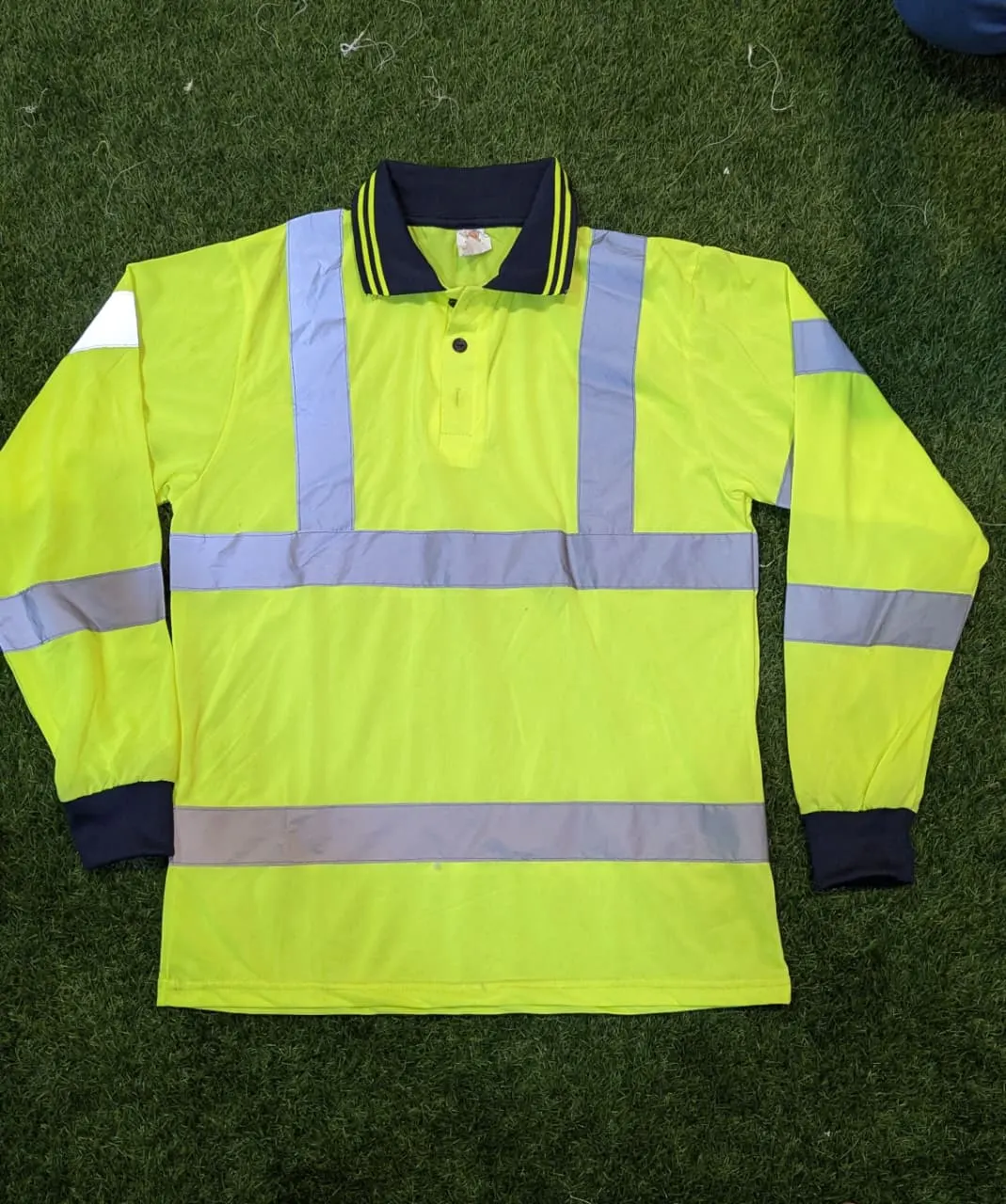 Custom yellow hi-vis polo shirt with reflective tape made by Ravix Pro Industry clothing manufacturer in Sialkot, Pakistan