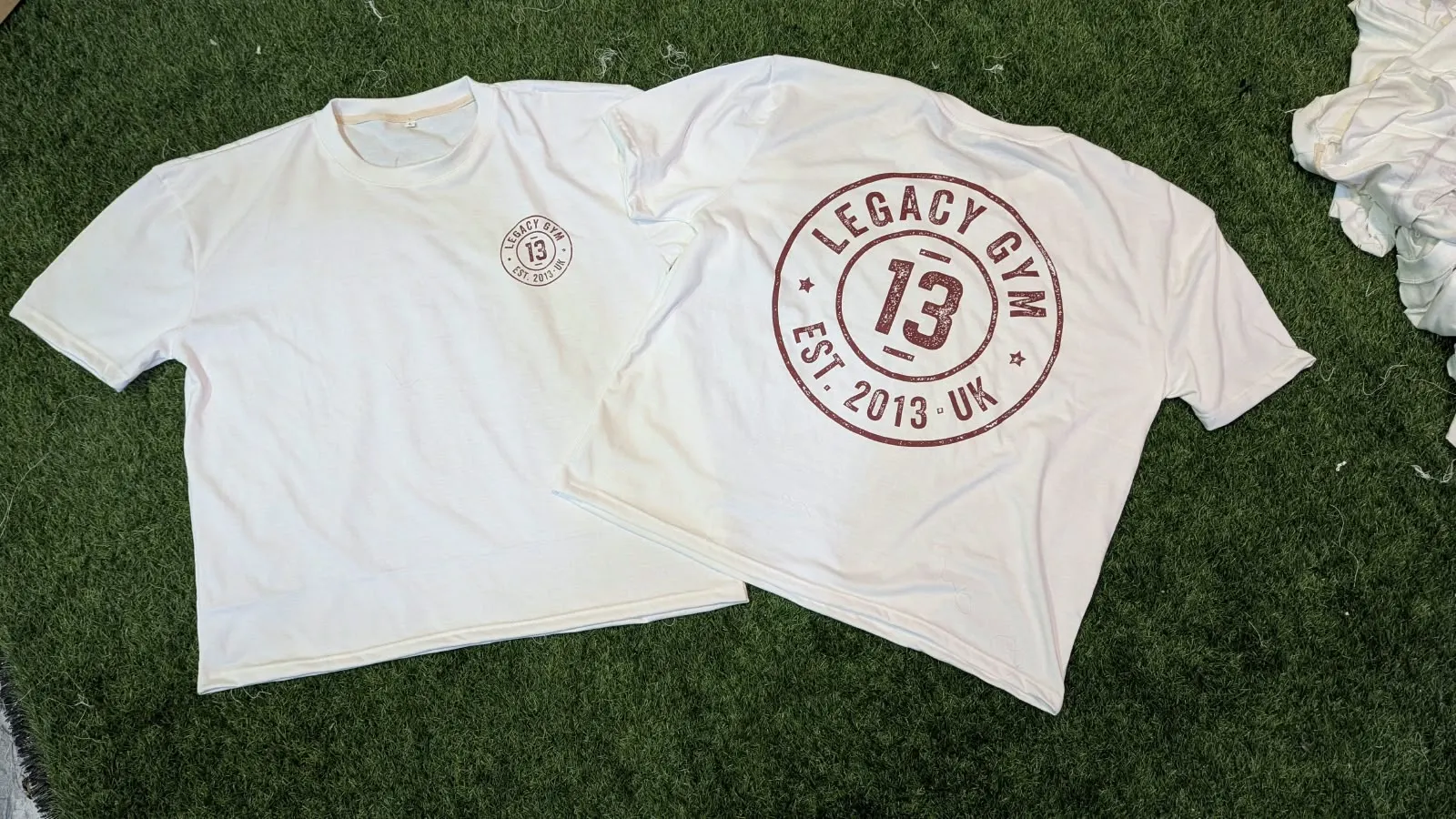 Custom white T-shirt with screen printed logo made by Ravix Pro Industry clothing manufacturer in Sialkot, Pakistan