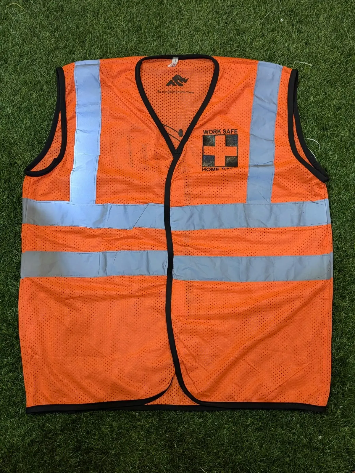 Custom orange hi-vis safety vest made by Ravix Pro Industry clothing manufacturer in Sialkot, Pakistan