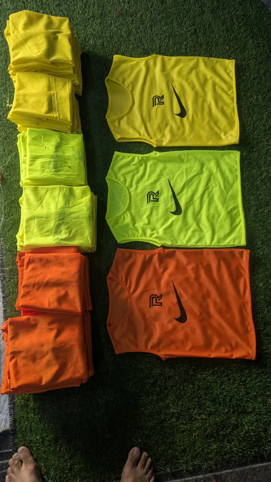 Custom training bibs in hi-vis colours made by Ravix Pro Industry clothing manufacturer in Sialkot, Pakistan