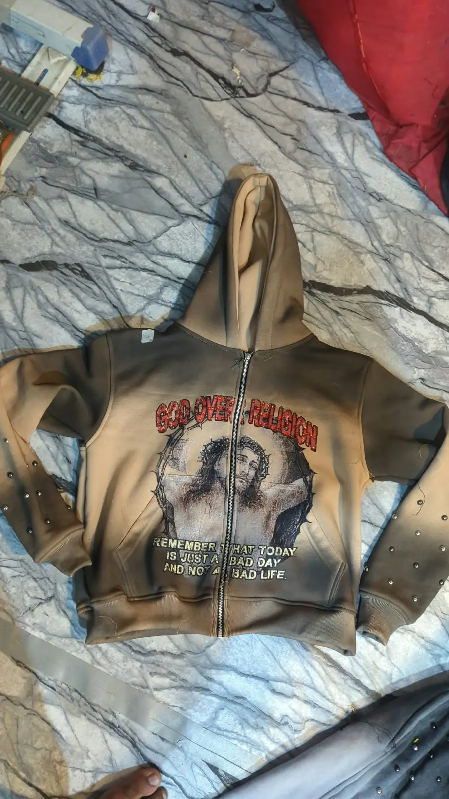 Custom vintage wash hoodie with graphic print made by Ravix Pro Industry clothing manufacturer in Sialkot, Pakistan