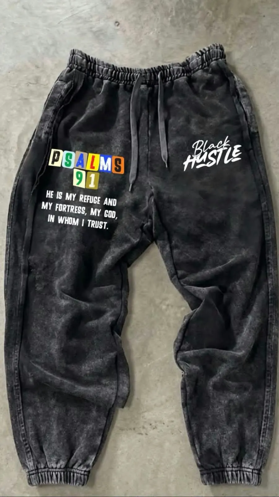 Custom acid wash sweatpants with puff print made by Ravix Pro Industry clothing manufacturer in Sialkot, Pakistan