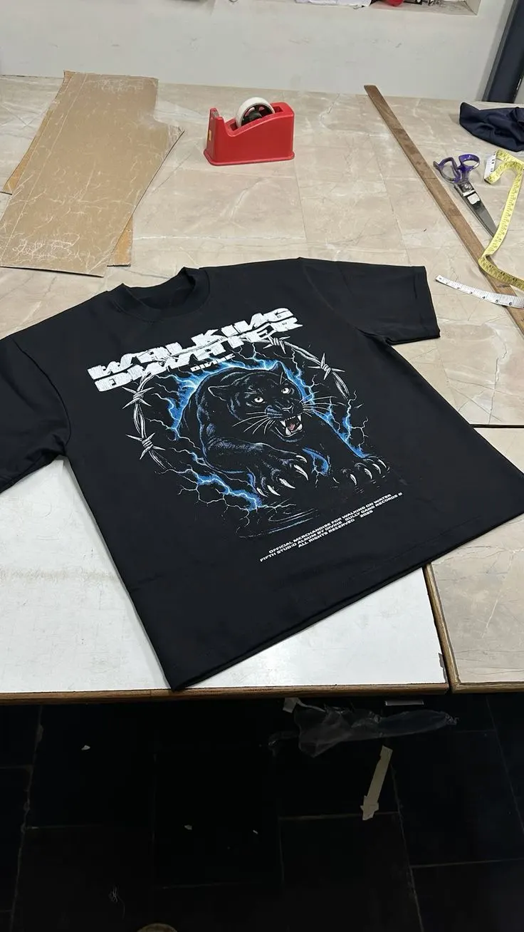 Custom black T-shirt with multi-colour print made by Ravix Pro Industry clothing manufacturer in Sialkot, Pakistan
