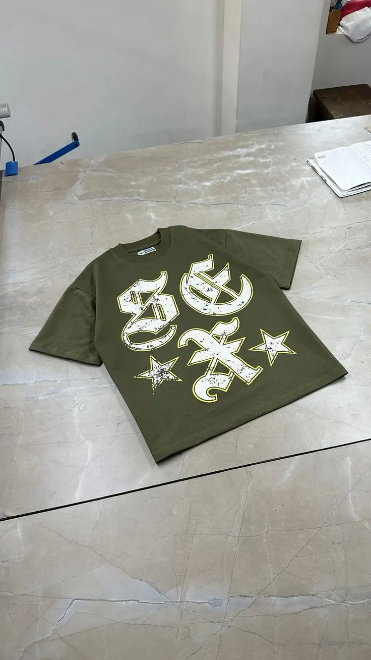 Custom olive T-shirt with white puff print made by Ravix Pro Industry clothing manufacturer in Sialkot, Pakistan