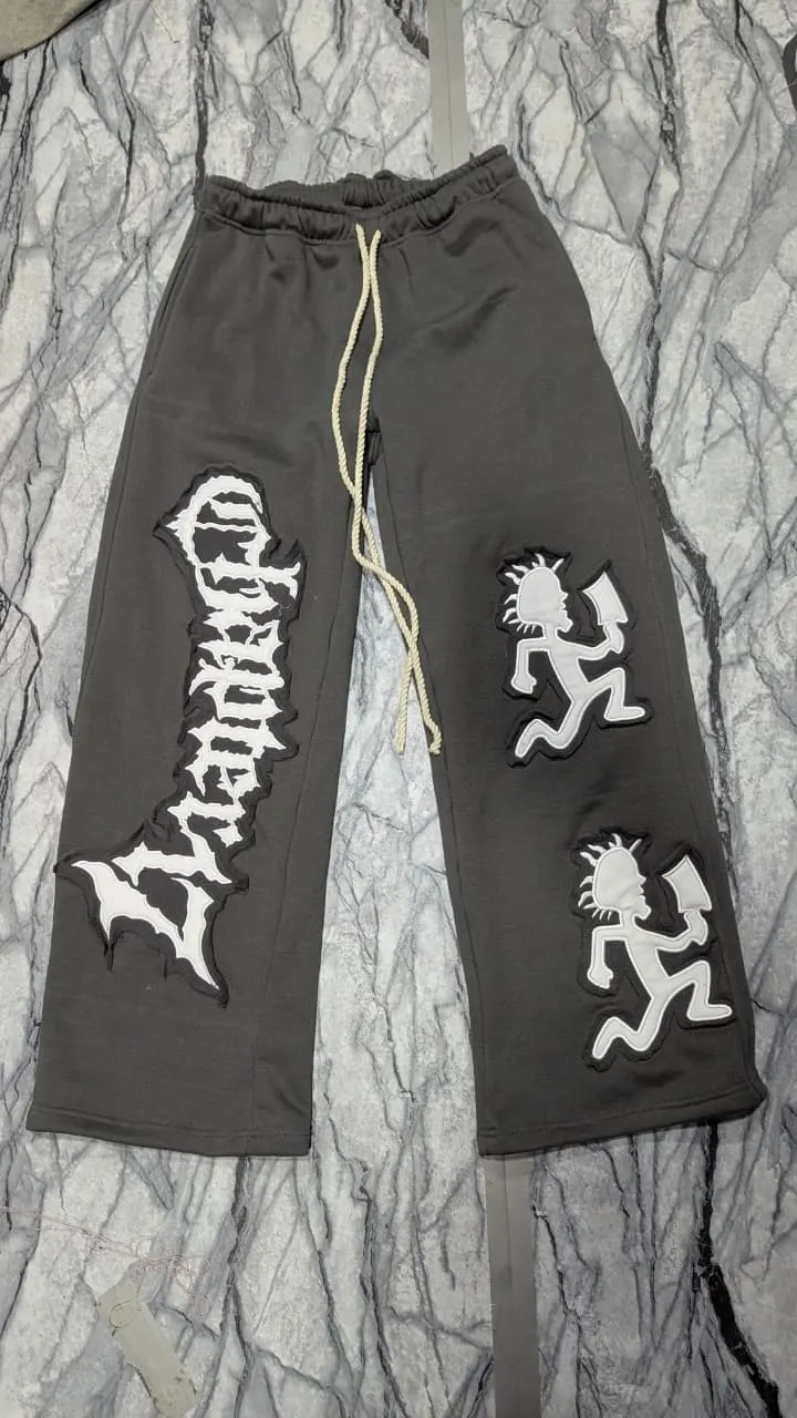 Custom black flare sweatpants with print made by Ravix Pro Industry clothing manufacturer in Sialkot, Pakistan