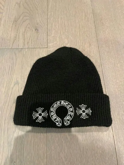 Custom black knitted beanie with jacquard logo made by Ravix Pro Industry clothing manufacturer in Sialkot, Pakistan