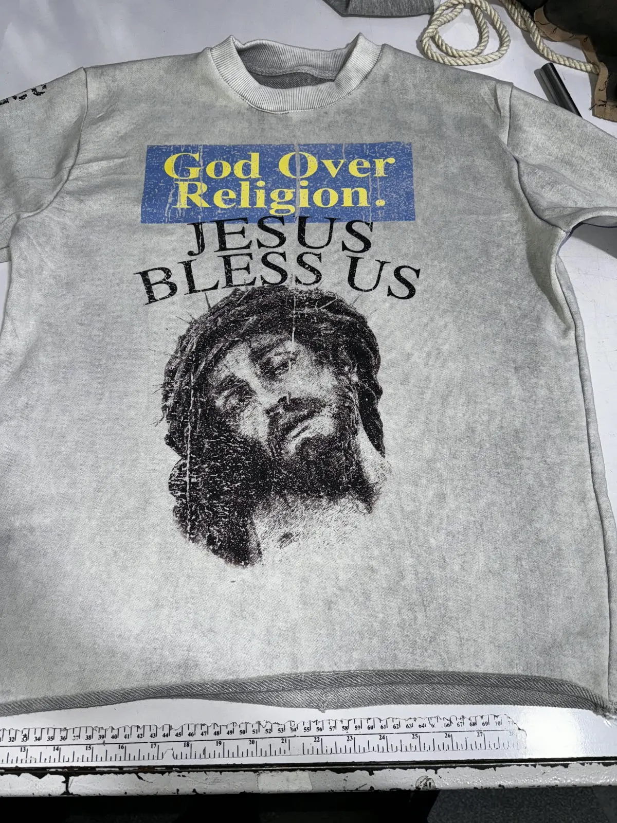 Custom grey T-shirt with vintage graphic print made by Ravix Pro Industry clothing manufacturer in Sialkot, Pakistan