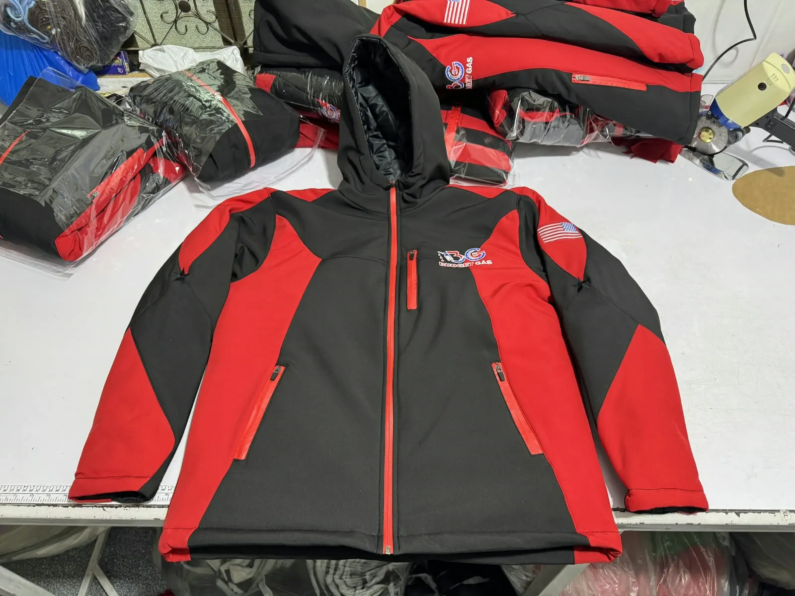 Custom red and black softshell jacket made by Ravix Pro Industry clothing manufacturer in Sialkot, Pakistan