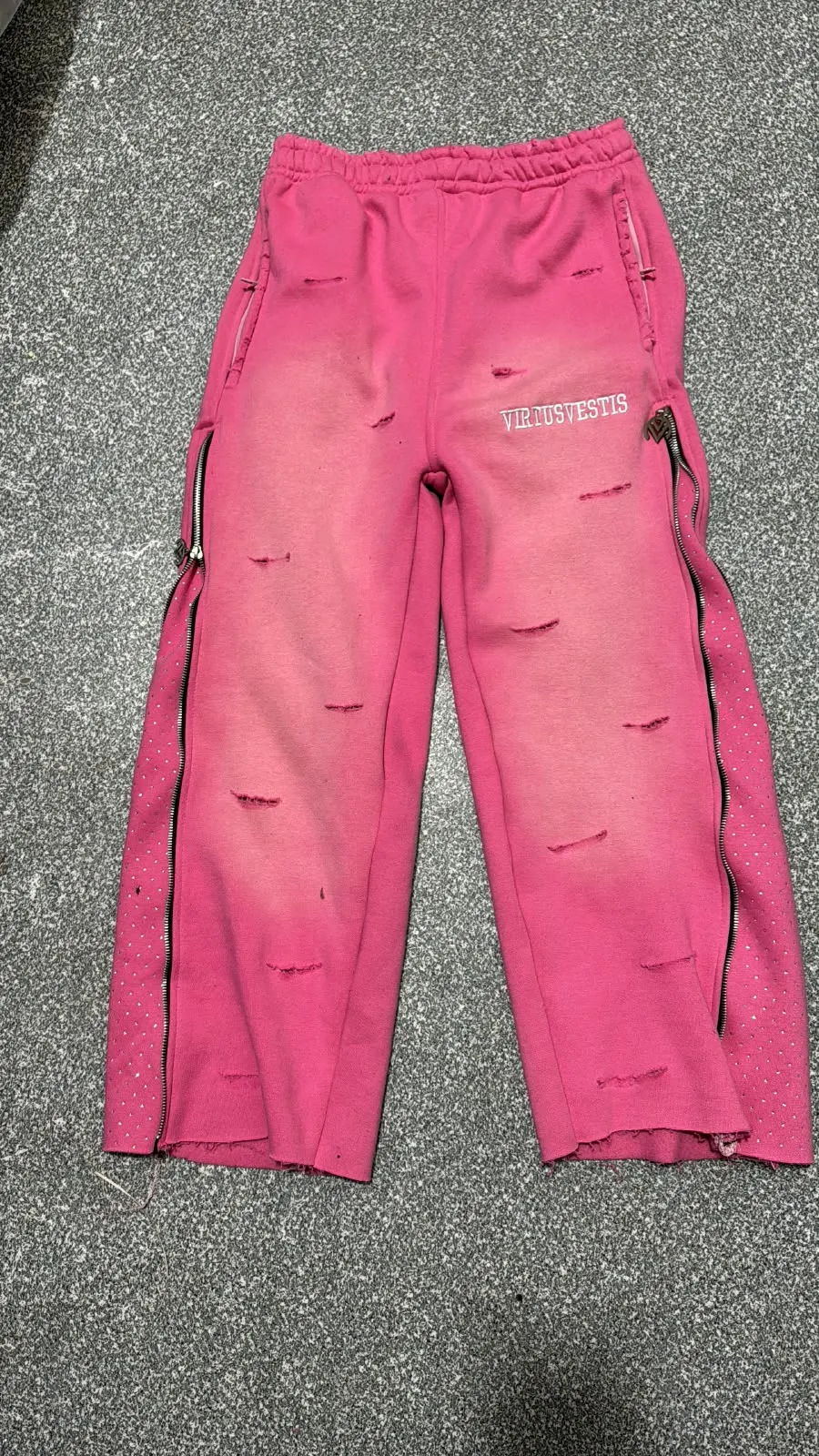 Custom washed pink distressed sweatpants made by Ravix Pro Industry clothing manufacturer in Sialkot, Pakistan