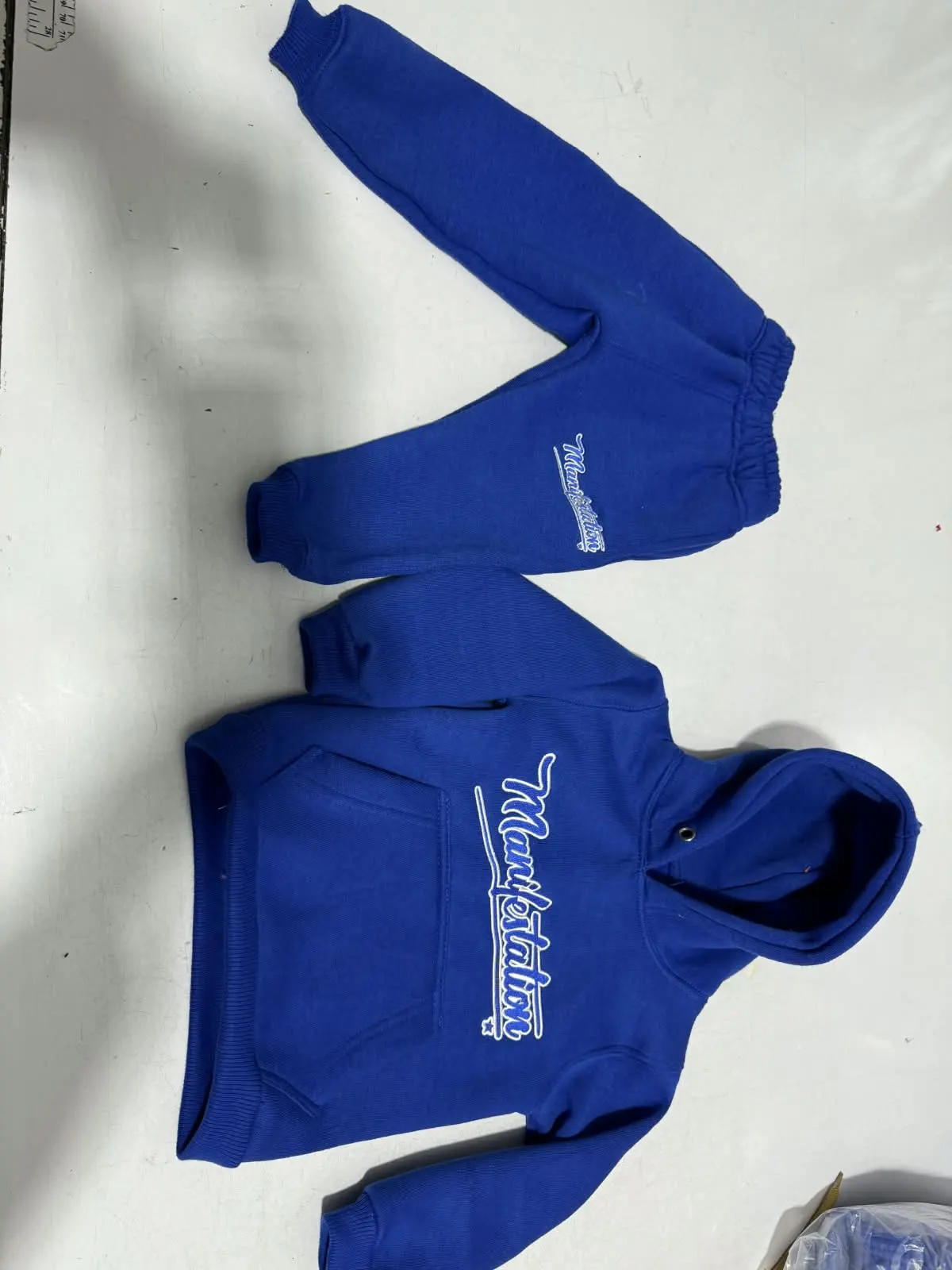Custom royal blue hoodie with embroidered logo made by Ravix Pro Industry clothing manufacturer in Sialkot, Pakistan