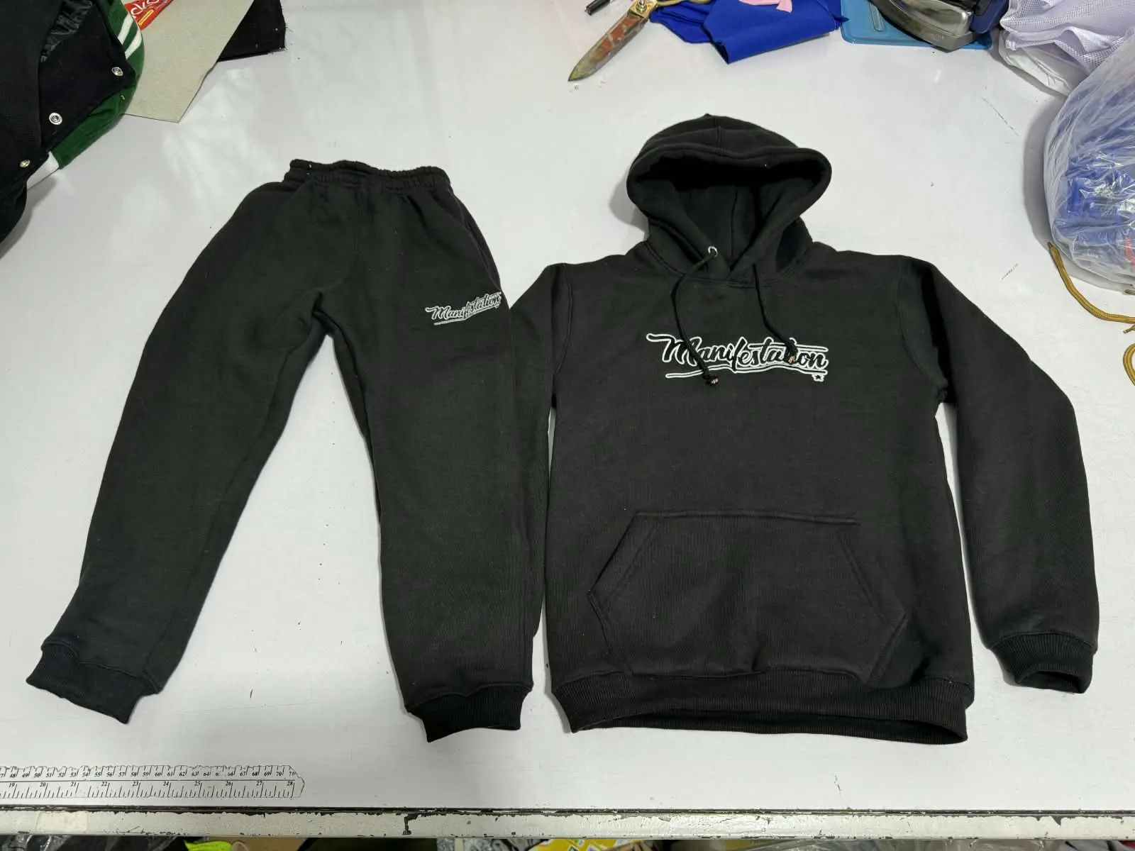 Custom black hoodie and sweatpants set made by Ravix Pro Industry clothing manufacturer in Sialkot, Pakistan
