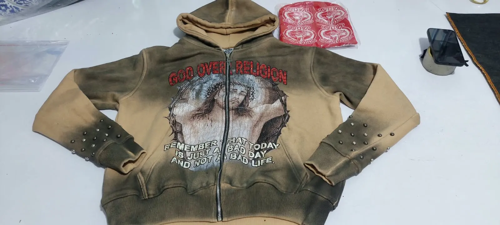 Custom hoodie with rhinestone design made by Ravix Pro Industry clothing manufacturer in Sialkot, Pakistan