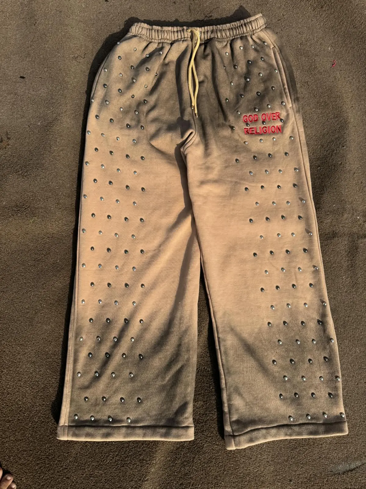 Custom washed brown sweatpants with rhinestones made by Ravix Pro Industry clothing manufacturer in Sialkot, Pakistan