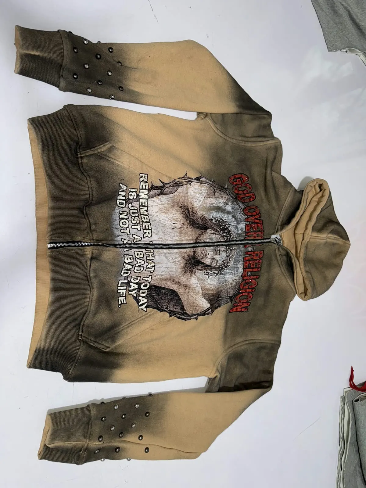Custom sun-faded zip hoodie with graphic print made by Ravix Pro Industry clothing manufacturer in Sialkot, Pakistan