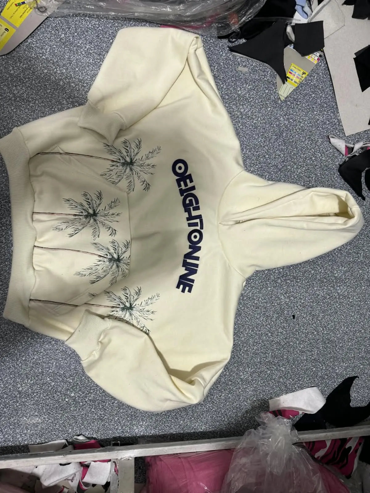 Custom cream hoodie with embroidered logo made by Ravix Pro Industry clothing manufacturer in Sialkot, Pakistan