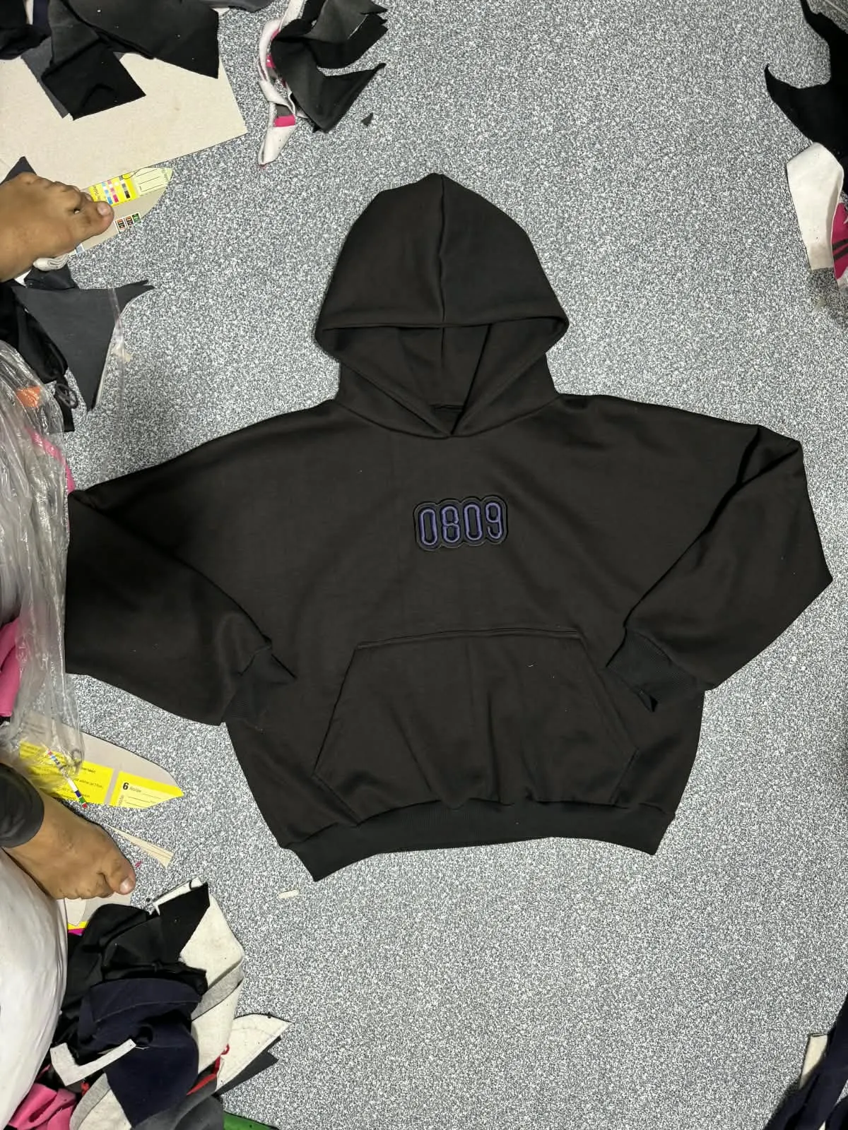 Custom black heavyweight hoodie with embroidery made by Ravix Pro Industry clothing manufacturer in Sialkot, Pakistan