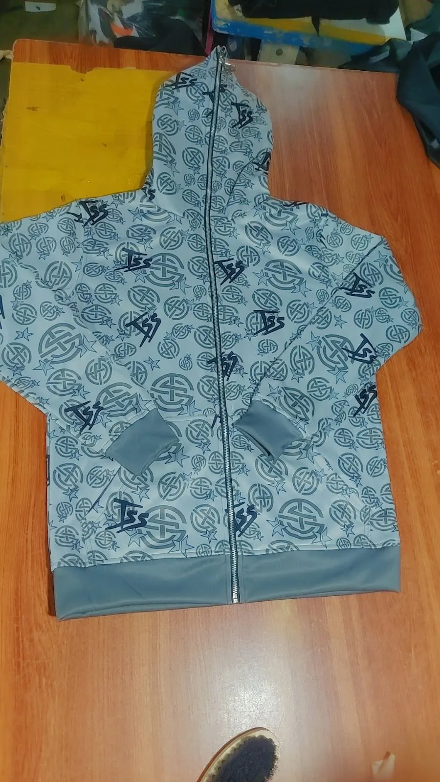 Custom all-over printed zip hoodie made by Ravix Pro Industry clothing manufacturer in Sialkot, Pakistan