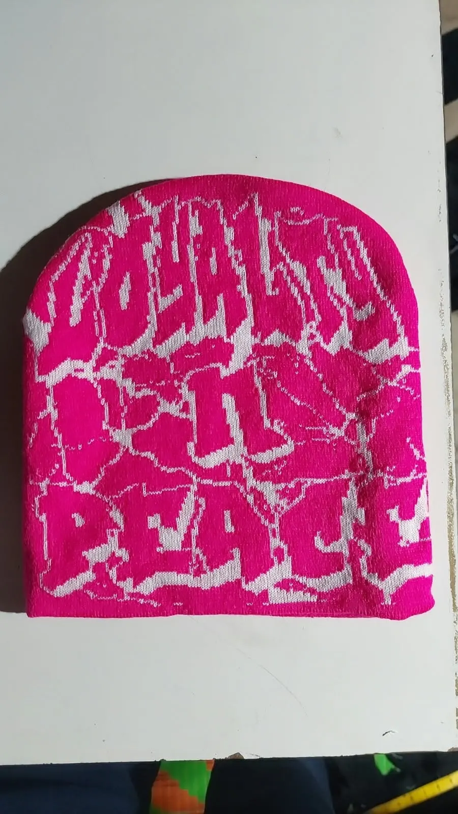 Custom pink jacquard knitted beanie made by Ravix Pro Industry clothing manufacturer in Sialkot, Pakistan