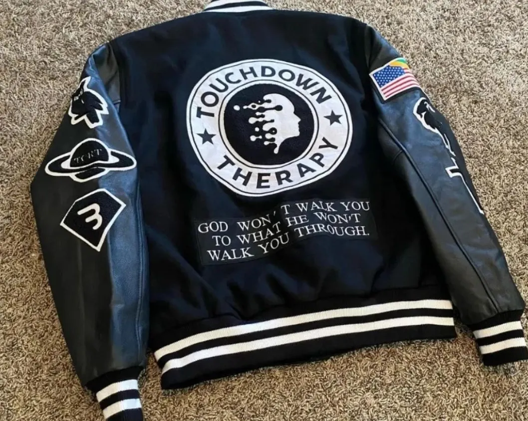 Custom black varsity jacket with chenille patch made by Ravix Pro Industry clothing manufacturer in Sialkot, Pakistan