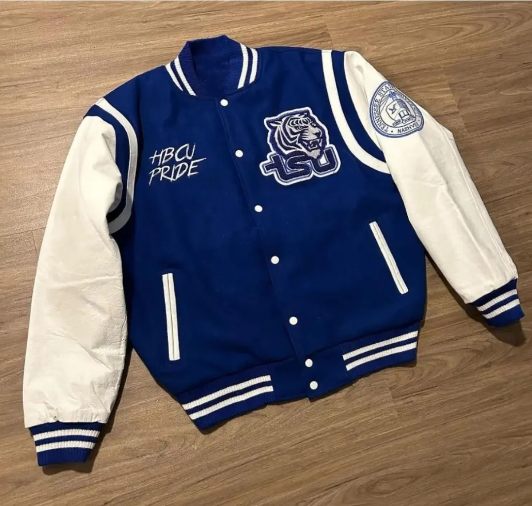 Custom royal blue varsity jacket with white sleeves made by Ravix Pro Industry clothing manufacturer in Sialkot, Pakistan