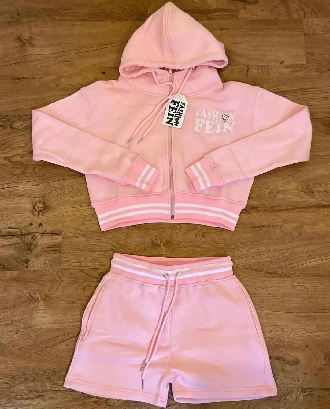Custom pink zip hoodie and shorts set made by Ravix Pro Industry clothing manufacturer in Sialkot, Pakistan