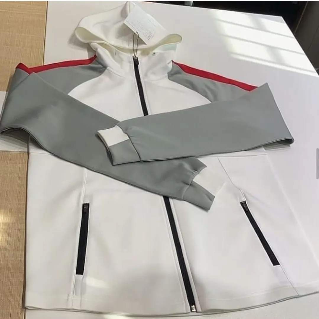 Custom grey and white zip jacket with contrast panels made by Ravix Pro Industry clothing manufacturer in Sialkot, Pakistan