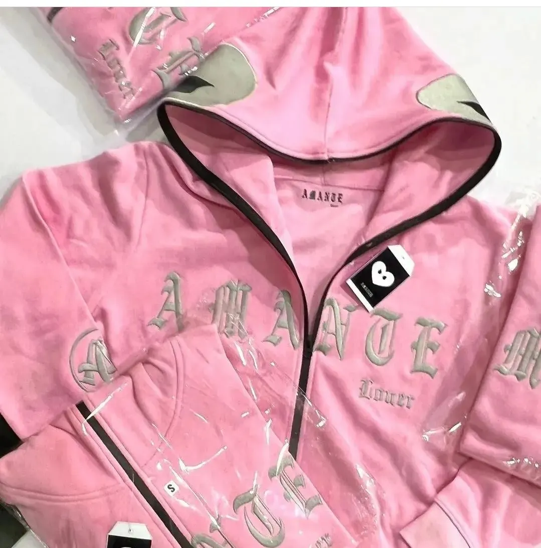 Custom pink zip hoodie with embroidered lettering made by Ravix Pro Industry clothing manufacturer in Sialkot, Pakistan