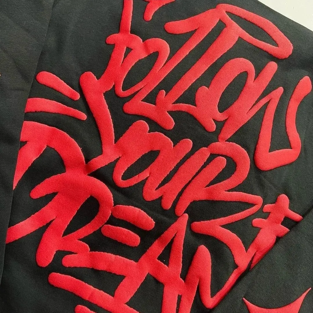 Custom 3D puff embroidery on a black hoodie made by Ravix Pro Industry clothing manufacturer in Sialkot, Pakistan