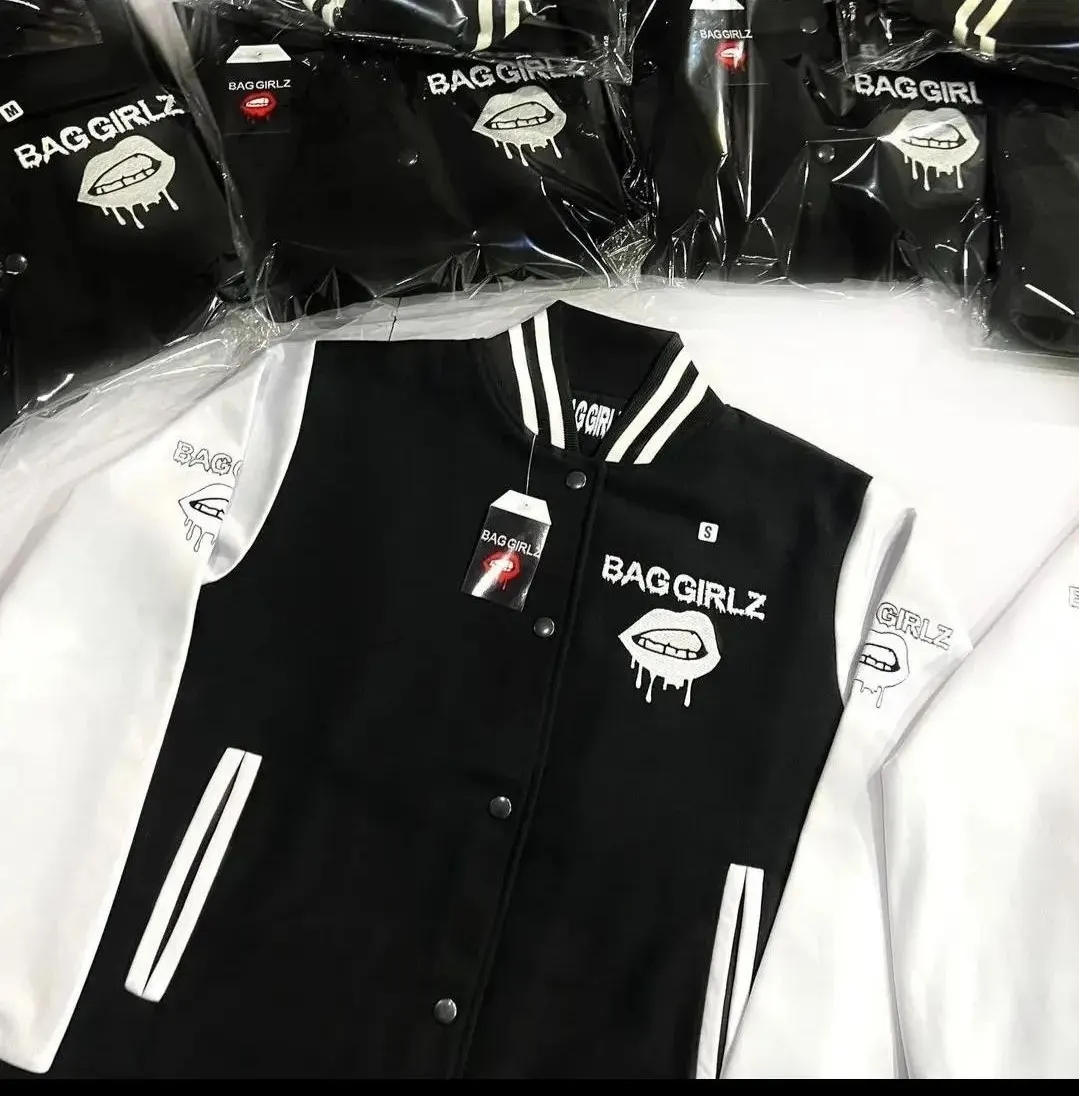 Custom black and white varsity jackets for a bulk order made by Ravix Pro Industry clothing manufacturer in Sialkot, Pakistan