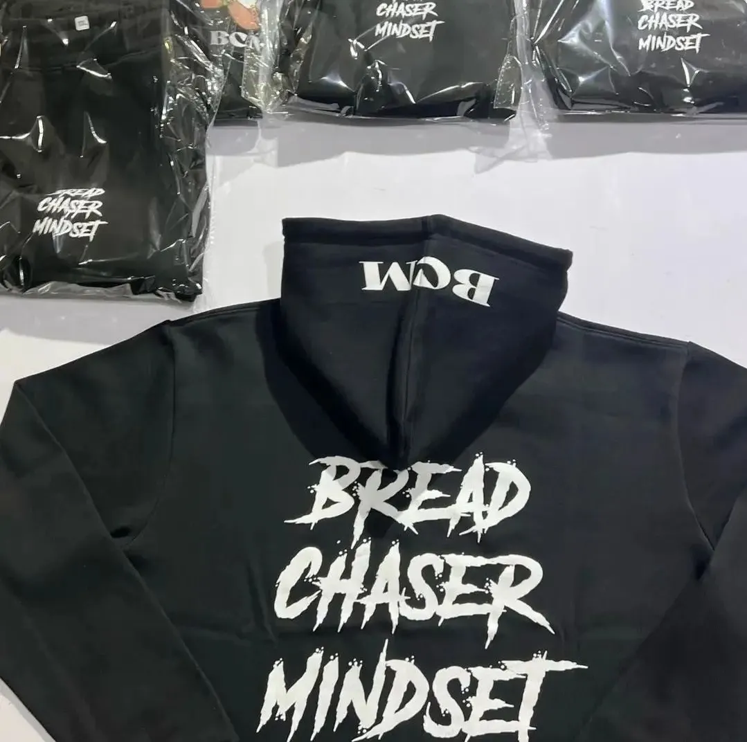 Custom black hoodie with puff print back graphic made by Ravix Pro Industry clothing manufacturer in Sialkot, Pakistan