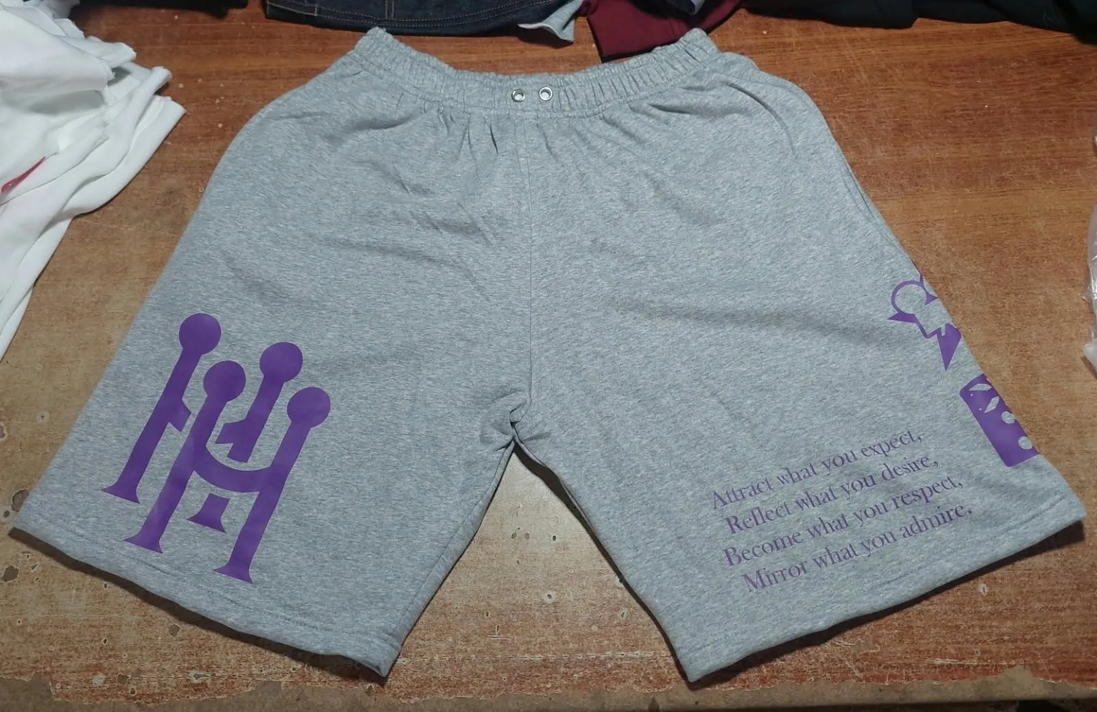Custom grey shorts with embroidered logo made by Ravix Pro Industry clothing manufacturer in Sialkot, Pakistan