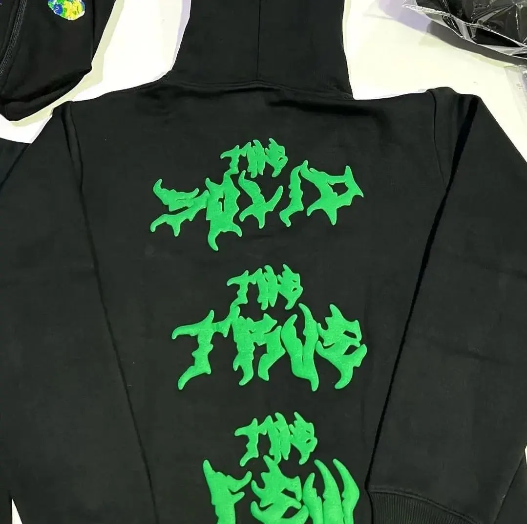 Custom black hoodie with puff print sleeves made by Ravix Pro Industry clothing manufacturer in Sialkot, Pakistan