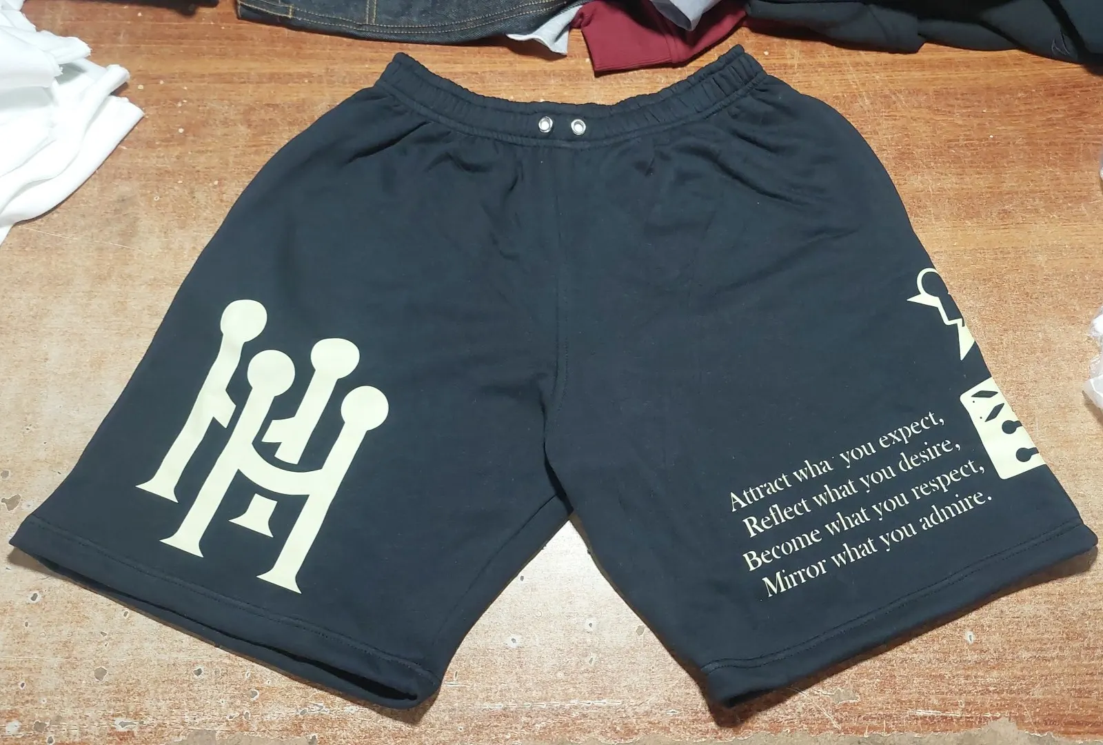 Custom black shorts with embroidered logo made by Ravix Pro Industry clothing manufacturer in Sialkot, Pakistan