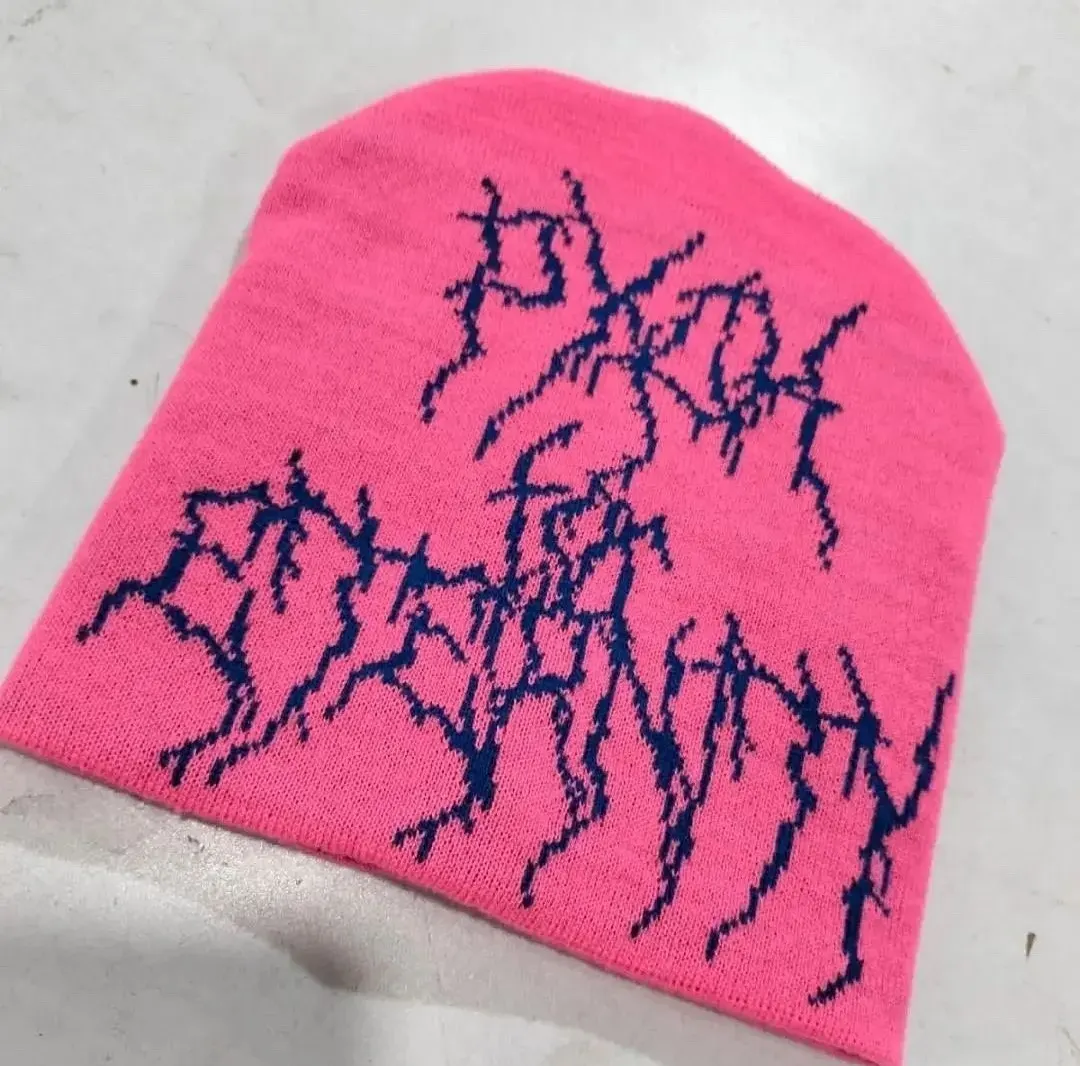 Custom pink knitted beanie with jacquard lettering made by Ravix Pro Industry clothing manufacturer in Sialkot, Pakistan