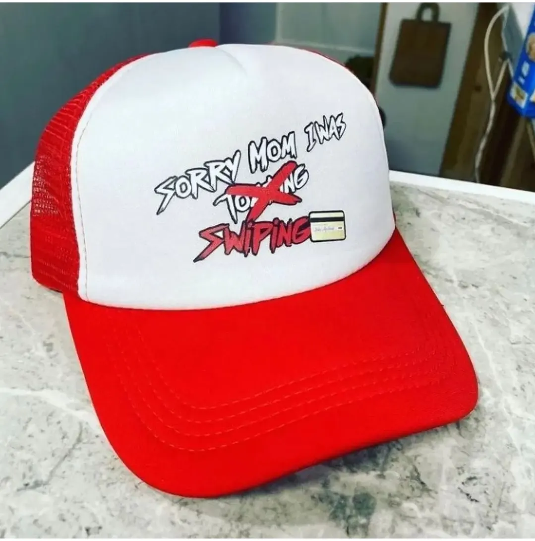 Custom red and white trucker cap with print made by Ravix Pro Industry clothing manufacturer in Sialkot, Pakistan