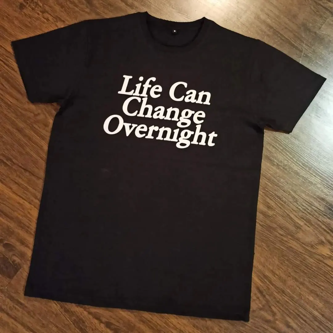 Custom black T-shirt with screen printed slogan made by Ravix Pro Industry clothing manufacturer in Sialkot, Pakistan