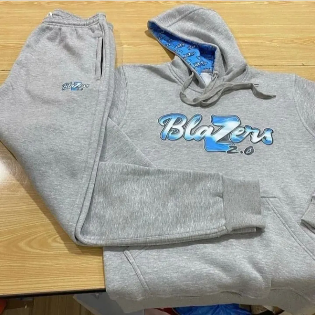 Custom grey sweatsuit with embroidered logo made by Ravix Pro Industry clothing manufacturer in Sialkot, Pakistan