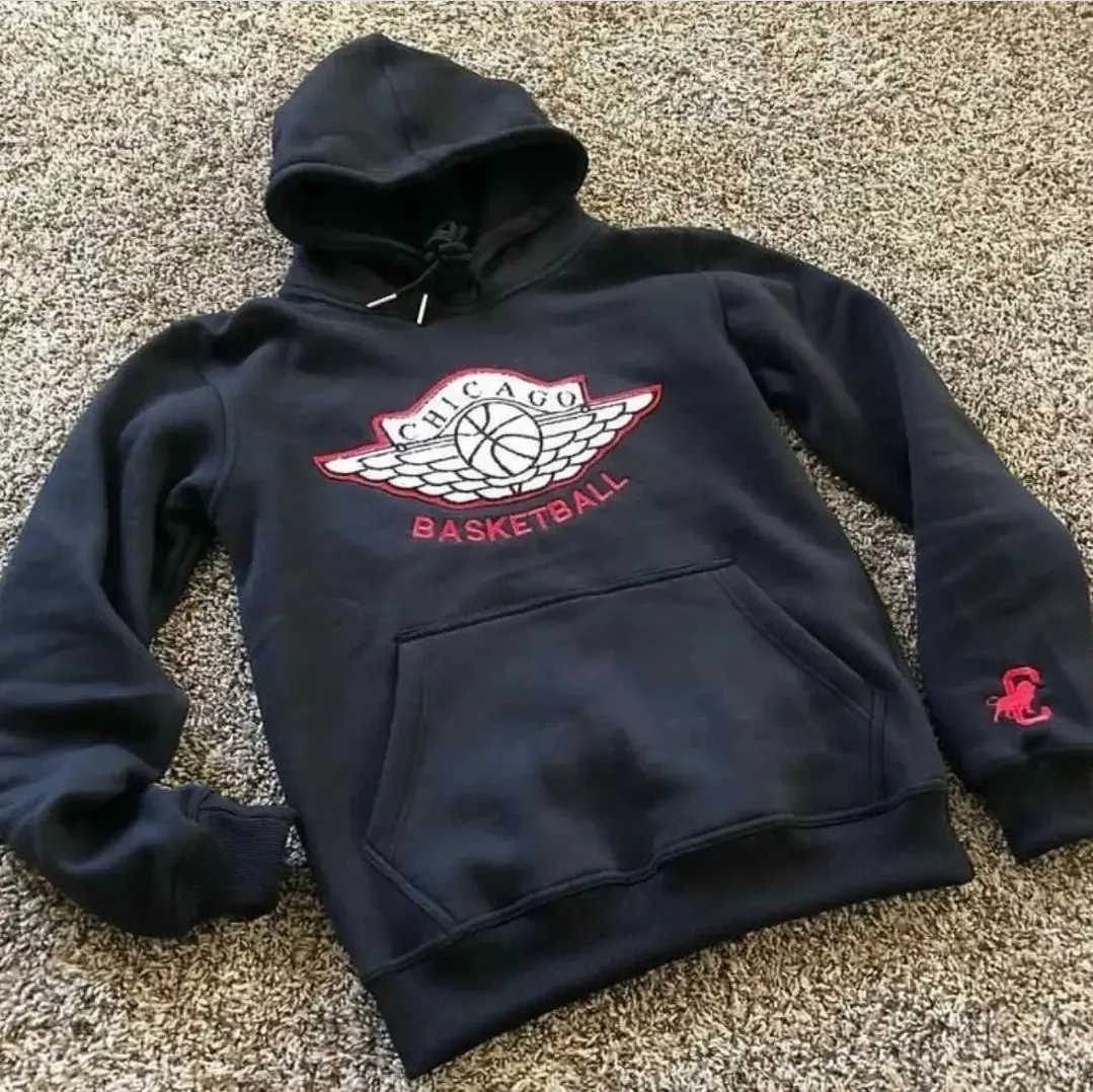 Custom black hoodie with printed graphic made by Ravix Pro Industry clothing manufacturer in Sialkot, Pakistan
